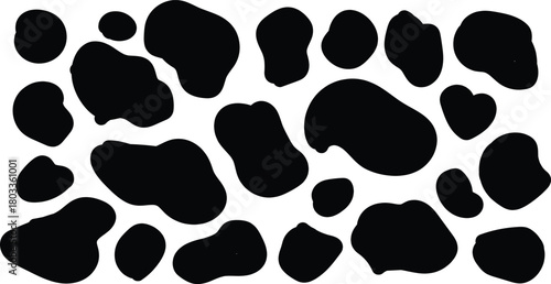 Black and white abstract cow print pattern with irregular organic shapes