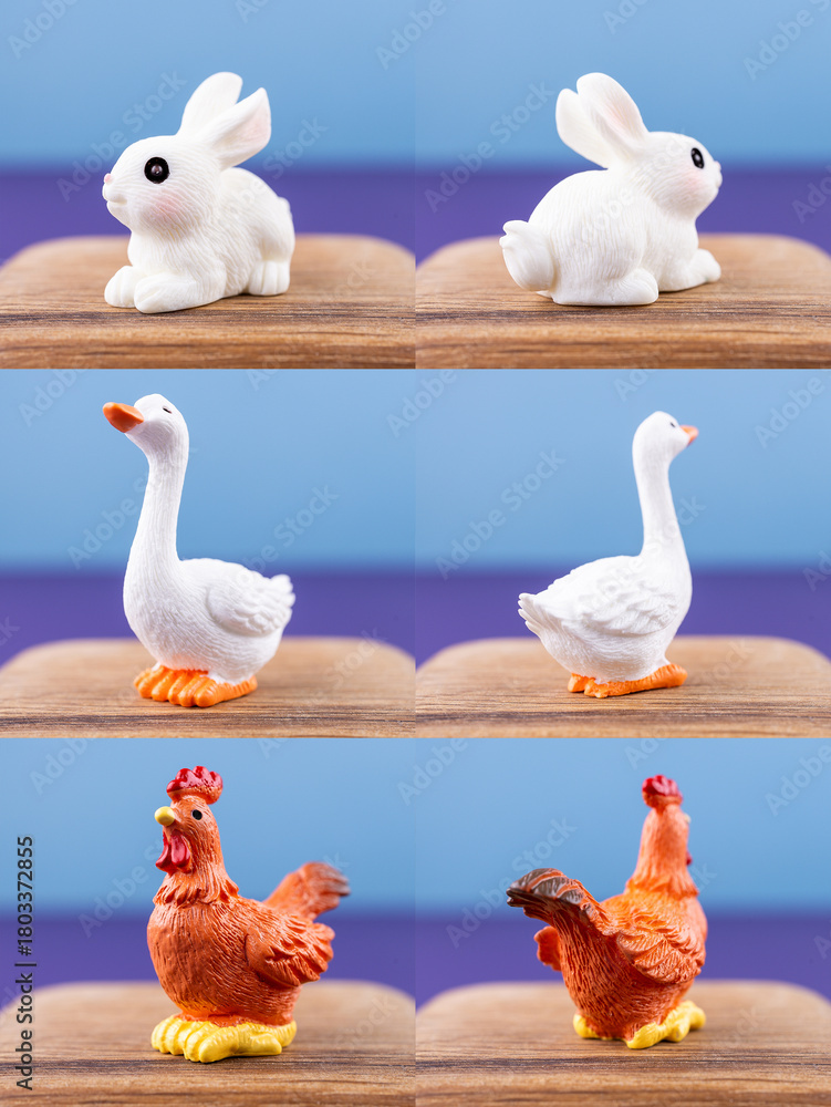 Obraz premium Close-up of small, cute figurines of domestic animals: rabbit, goose, rooster, displayed on a wooden podium