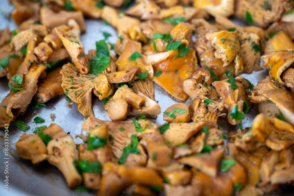 Fototapeta premium Chanterelle Mushrooms Cooked in Butter with Fresh Parsley