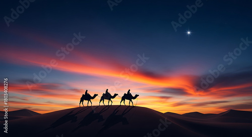Three wise men silhouettes riding camels across a desert dune at sunset