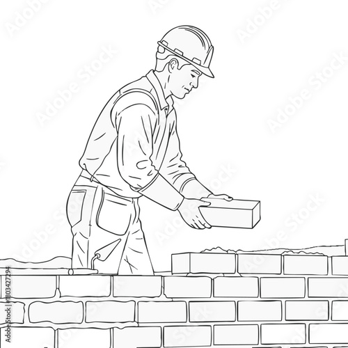 A construction worker carefully places a brick onto a newly built wall, demonstrating skillful craftsmanship and building expertise in the process.