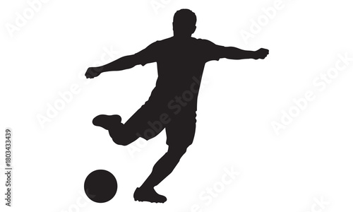 Soccer player kicking ball silhouette