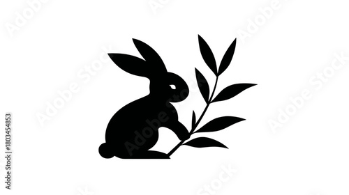 Black rabbit silhouette holding a plant stem with leaves, isolated graphic icon on white background, nature animal symbol