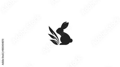 Minimalist black rabbit silhouette with stylized leaves, a clean graphic icon for nature, wildlife, or organic design concepts.
