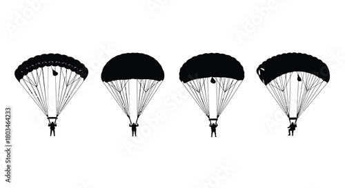 Four parachutists are descending from the sky