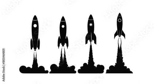 Four rockets taking off in black silhouette