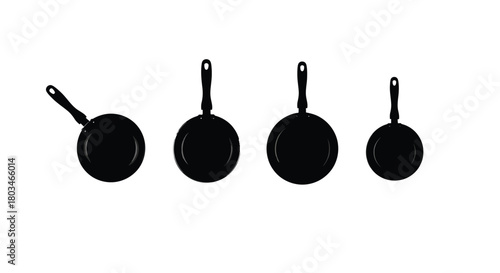 Four frying pans of different sizes