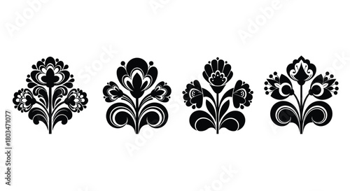 Set of four black floral ornaments