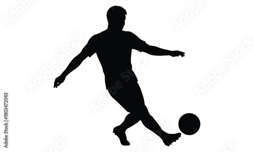 Soccer player kicking ball silhouette