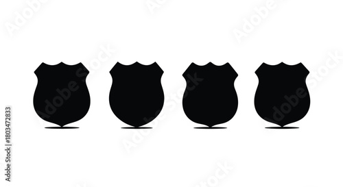 Four shield silhouettes in a row