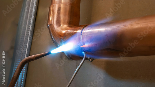 Photos copper pipe soldering process with tin by specialized technicians