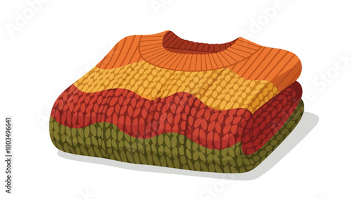 A stack of three neatly folded knit sweaters in autumn colors orange yellow red and green casting a light shadow