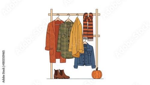 Autumn clothes on a wooden rack an orange cardigan plaid shirt yellow coat denim jacket striped scarf Boots and a pumpkin are below