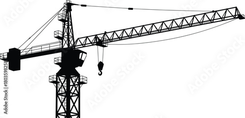 Silhouette of tall construction tower crane with long boom arm and hook used for heavy lifting operations