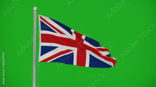 The Union Jack flag of the United Kingdom waving in the wind against a vibrant green screen background, perfect for keying out and compositing
