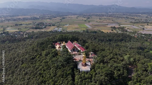 Wallpaper Mural Aerial view of Wat Phra That Chom Wae temple located in Phan district of Chiang Rai province of Thailand. This place is one of the 9 important pagodas of Chiang Rai province, Thailand. Torontodigital.ca