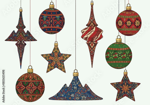 A collection of intricately patterned Christmas ornaments hanging against a white background.