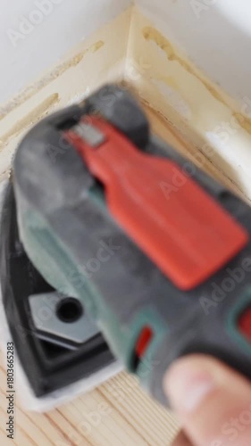Wallpaper Mural Close-up of an electric sander polishing a wooden surface during a DIY renovation. Torontodigital.ca