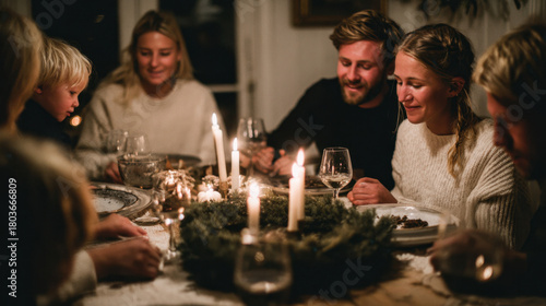 Family gathered around cozy candlelit holiday dinner, sharing food and warm moments together at home