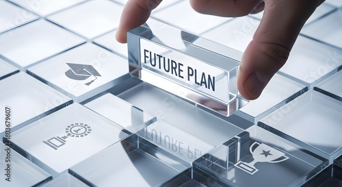 Finger placing a transparent block with future plan text on a keyboard