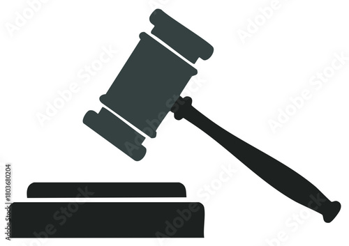 Judicial gavel poised to strike sound block representing justice and legal decisions