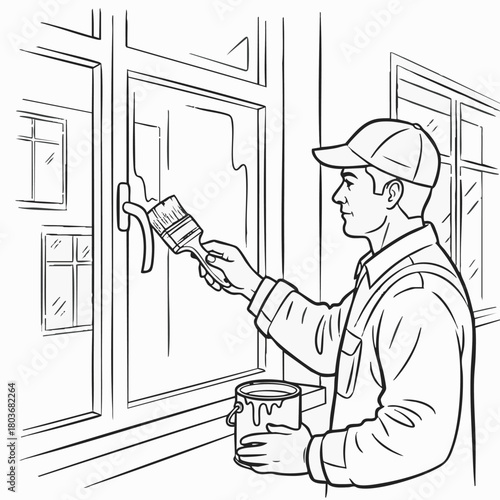 A diligent man wearing a cap and overalls carefully applies a fresh coat of paint to a window frame, undertaking a home improvement project.