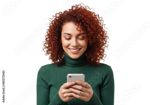 Smiling young woman with vibrant curly red hair wearing a green turtleneck holding a smartphone isolated on transparent background