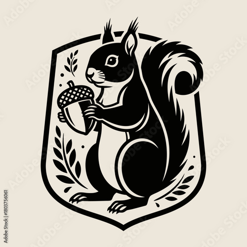 Black squirrel holding acorn emblem in a shield shape design.