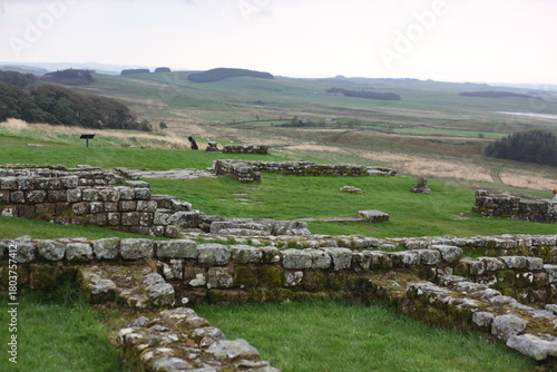 Landscape view of ancient monument Hadrian’s Wall. the rugged Scottish highland countryside, a dramatic historical landmark set against a windswept moorland backdrop