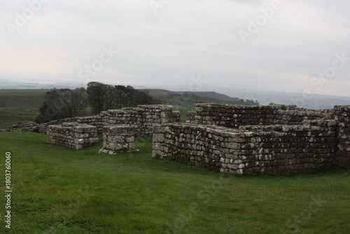 Landscape view of ancient monument Hadrian’s Wall. the rugged Scottish highland countryside, a dramatic historical landmark set against a windswept moorland backdrop