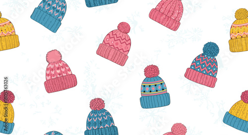 Seamless pattern of colorful knitted winter hats with pom-poms on a white background with subtle snowflakes, perfect for festive designs.