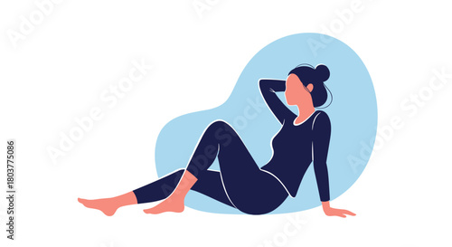 Woman in athletic wear relaxing on the floor after a workout.
