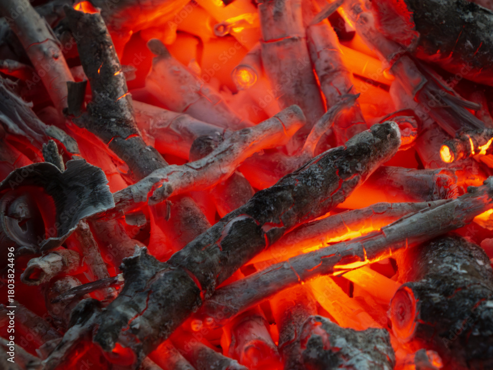 Naklejka premium Hot Glowing Red Charcoal and Burning Wood