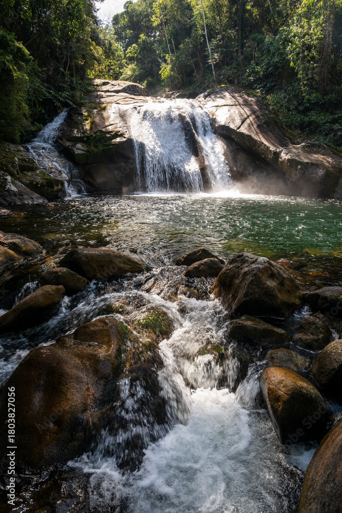 Fototapeta premium Beautiful view to green atlantic rainforest waterfall in Itatiaia