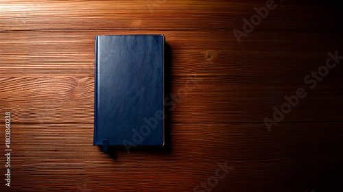 Holy Bible on the table. Leather-bound book. Light shining on the book. Prayer.