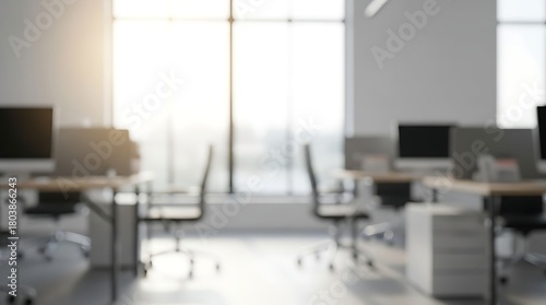 Blurred Modern Workplace with Desks and Computers