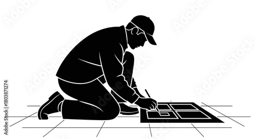 Craftsman carefully drawing tile design on floor for home improvement