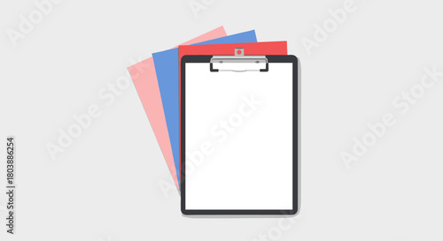 Overhead view of a black clipboard holding blank white paper with colorful sheets underneath, ready for notes or documentation.