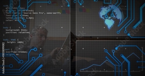 Working mid-adult man wearing dark top and glasses typing on laptop at dim workspace, code overlay