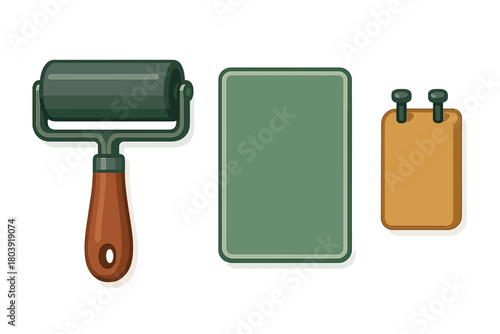 Set of printmaking tools including brayer roller, printing plate, and wooden block