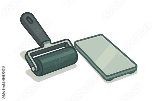 Brayer roller and rectangular inking plate used for printmaking and crafting projects