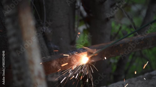 the process of electric welding of a metal structure with electrodes in the open air