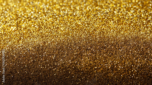 Luxuriöser goldener Glitzerhintergrund mit funkelnden Partikeln und sanftem Farbverlauf von hell nach dunkel.