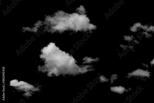Fototapeta Naklejka Na Ścianę i Meble -  Realistic isolated clouds on black background with off-white texture, natural fluffy shapes and atmospheric effects, perfect for design.