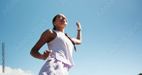 Konstfotografi Happy woman, fitness and winning with blue sky for race, sprint challenge or marathon in city