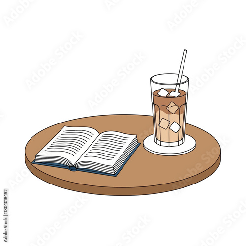 Open book and iced coffee drink on a round table.