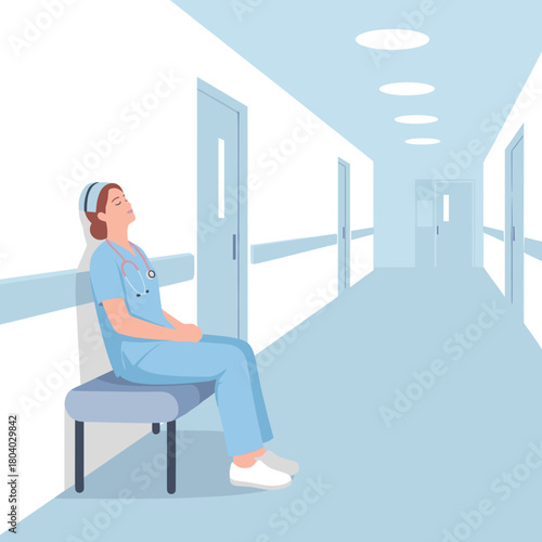 Nurse resting on chair in hospital corridor during break  