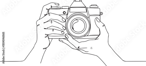 Minimalist Continuous one line drawing hands holding camera. One line drawing of camera linear style. Black image isolated on white background. 