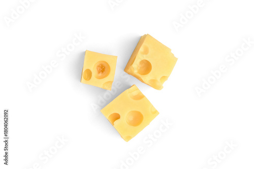 Maasdam cheese cubes isolated on white background.