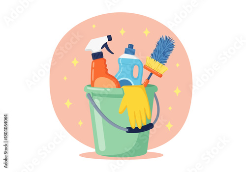 Illustration of a green bucket filled with cleaning supplies including spray bottles, a yellow glove, and a brush, set against a soft pink circular background with sparkling stars